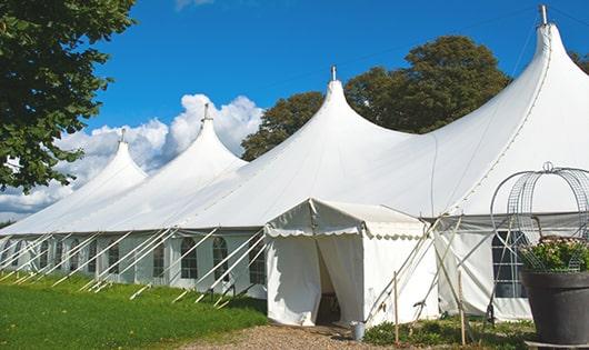 high-quality portable toilets stationed at a wedding, meeting the needs of guests throughout the outdoor reception in Estero